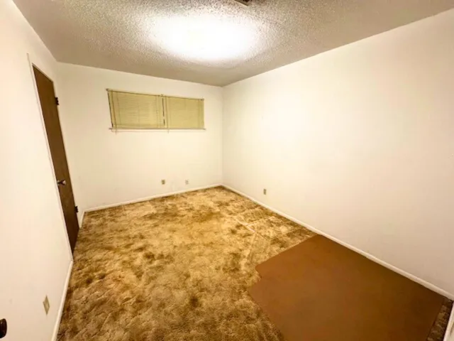 an empty room with a wooden floor