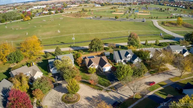 an aerial view of house with yard swimming pool and outdoor seating