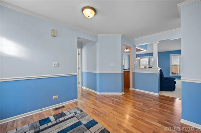 a view of room with wooden floor