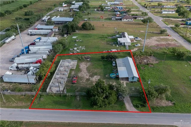 an aerial view of house with yard swimming pool and outdoor seating