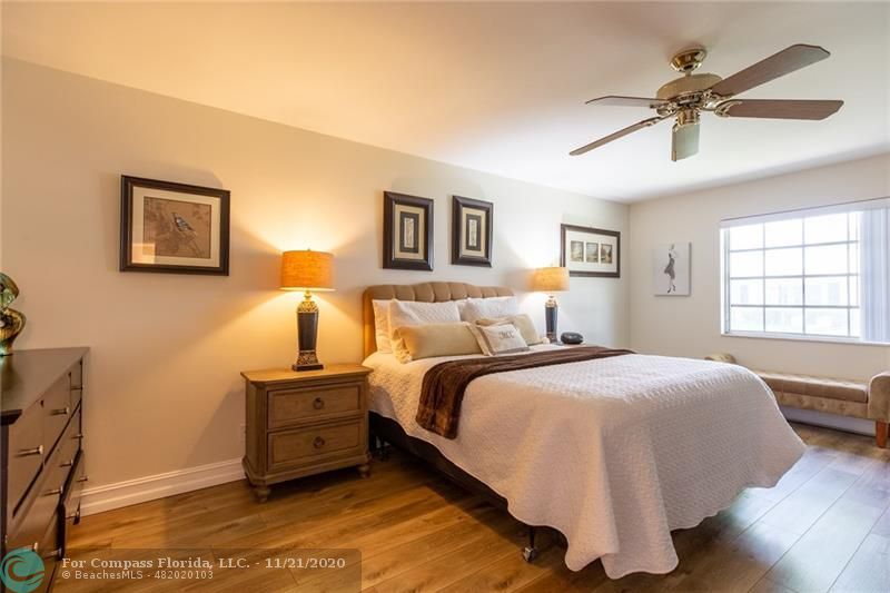 Limetree Condominiums Boynton Beach, FL 33436 - Photo 19 of 45 Enormous Primary Suite! This bright and spacious Owner's Bedroom measures approximately 12' X 20', plenty of room for a complete bedroom set and sitting area. Notice the modern flat ceilings, high profile baseboards and luxury vinyl floors!