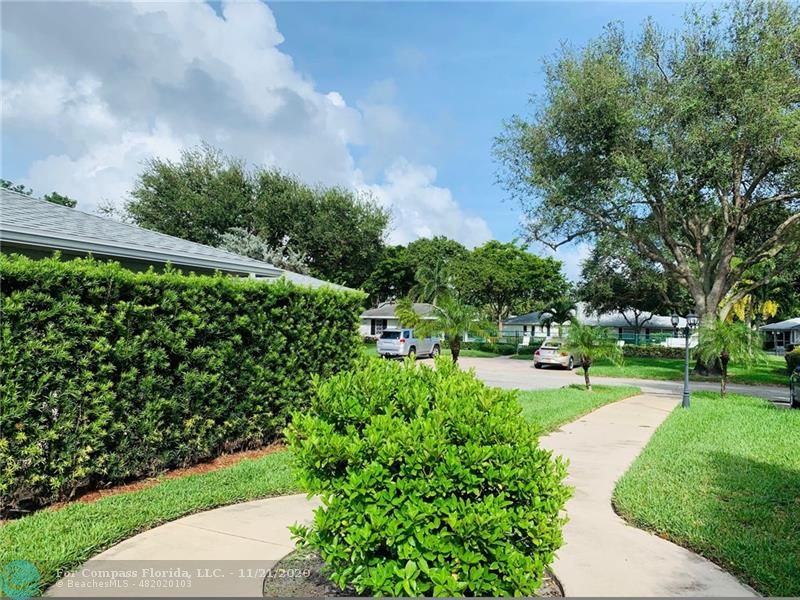 Limetree Condominiums Boynton Beach, FL 33436 - Photo 27 of 45 Limetree's East-side Pathway. landscaped and lighted, leads to the East Pool and Guest Parking...just across the street from Limetree Villa 252.