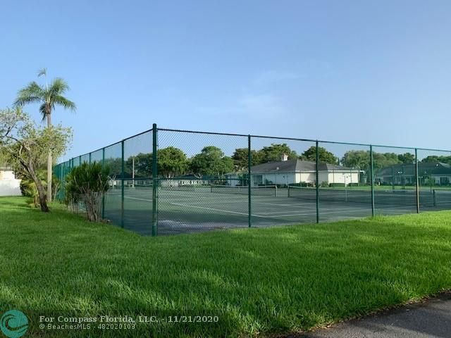 Limetree Condominiums Boynton Beach, FL 33436 - Photo 43 of 45 Another photo of Limetree's Tennis Courts 6 + Pickle Ball Courts 3, located at Limetree's Outdoor Recreation facilities on the multi-acre green-space. Limetree's Activity Building and Club House in the distance. All located just a few steps from Villa 252!