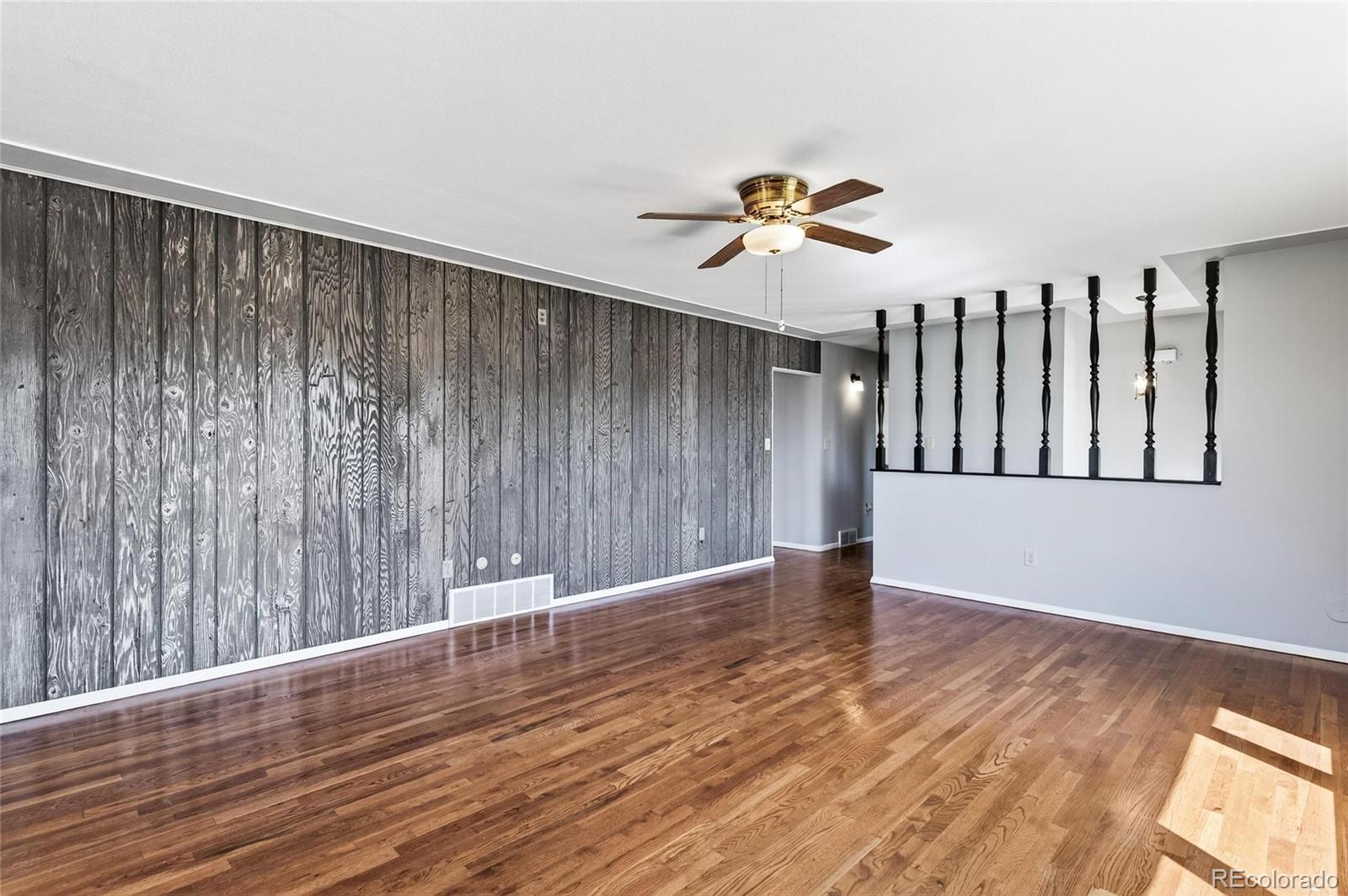 2869 Mathews Avenue Fort Lupton, CO 80621 - Photo 16 of 49 a view of entryway with wooden floor