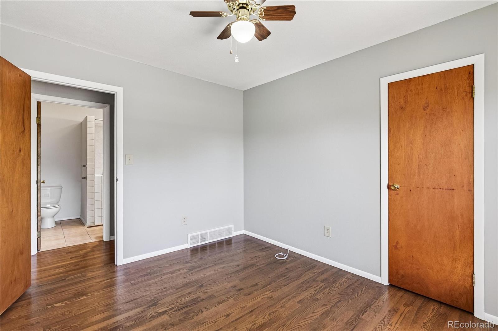 2869 Mathews Avenue Fort Lupton, CO 80621 - Photo 17 of 49 a view of an empty room with wooden floor