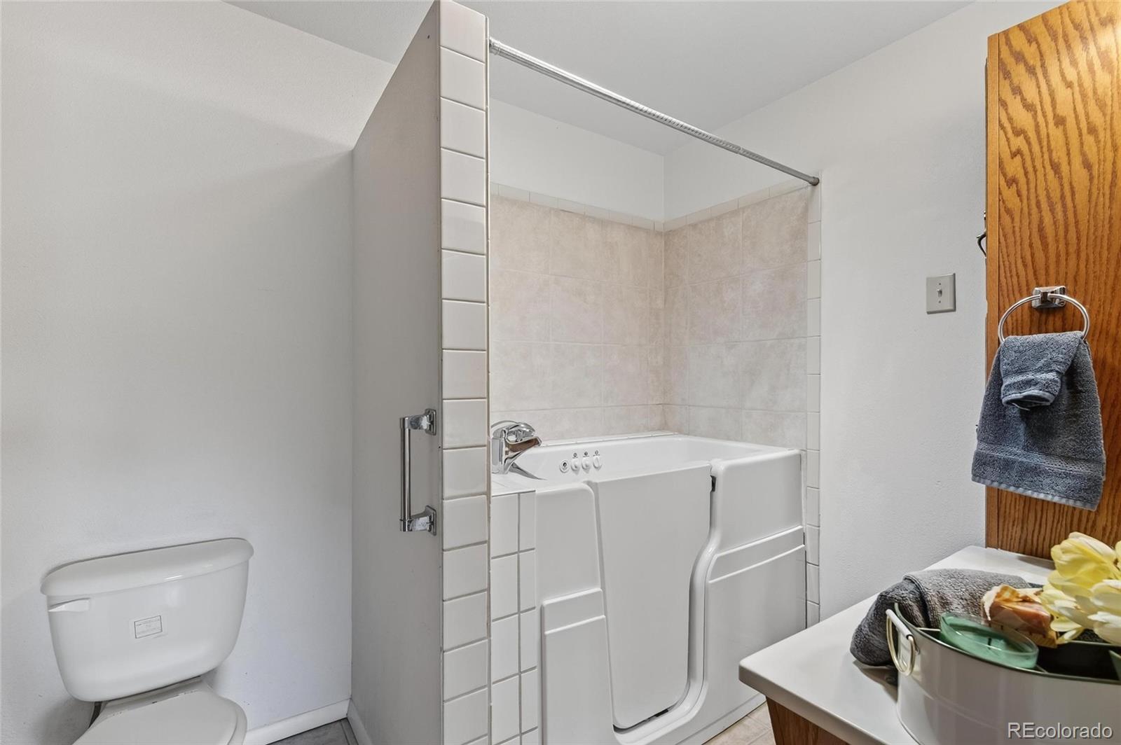2869 Mathews Avenue Fort Lupton, CO 80621 - Photo 25 of 49 a bathroom with a sink toilet and shower