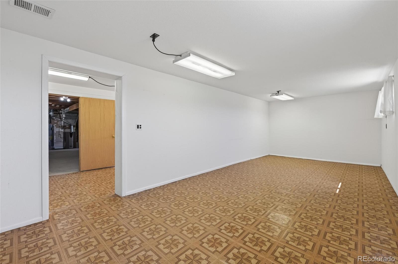 2869 Mathews Avenue Fort Lupton, CO 80621 - Photo 31 of 49 wooden floor in an empty room