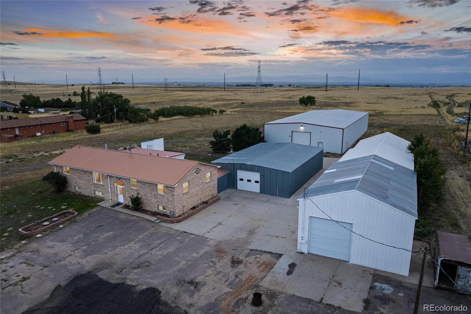 2869 Mathews Avenue Fort Lupton, CO 80621 - Photo 5 of 49 an aerial view of a house with a yard and lake view