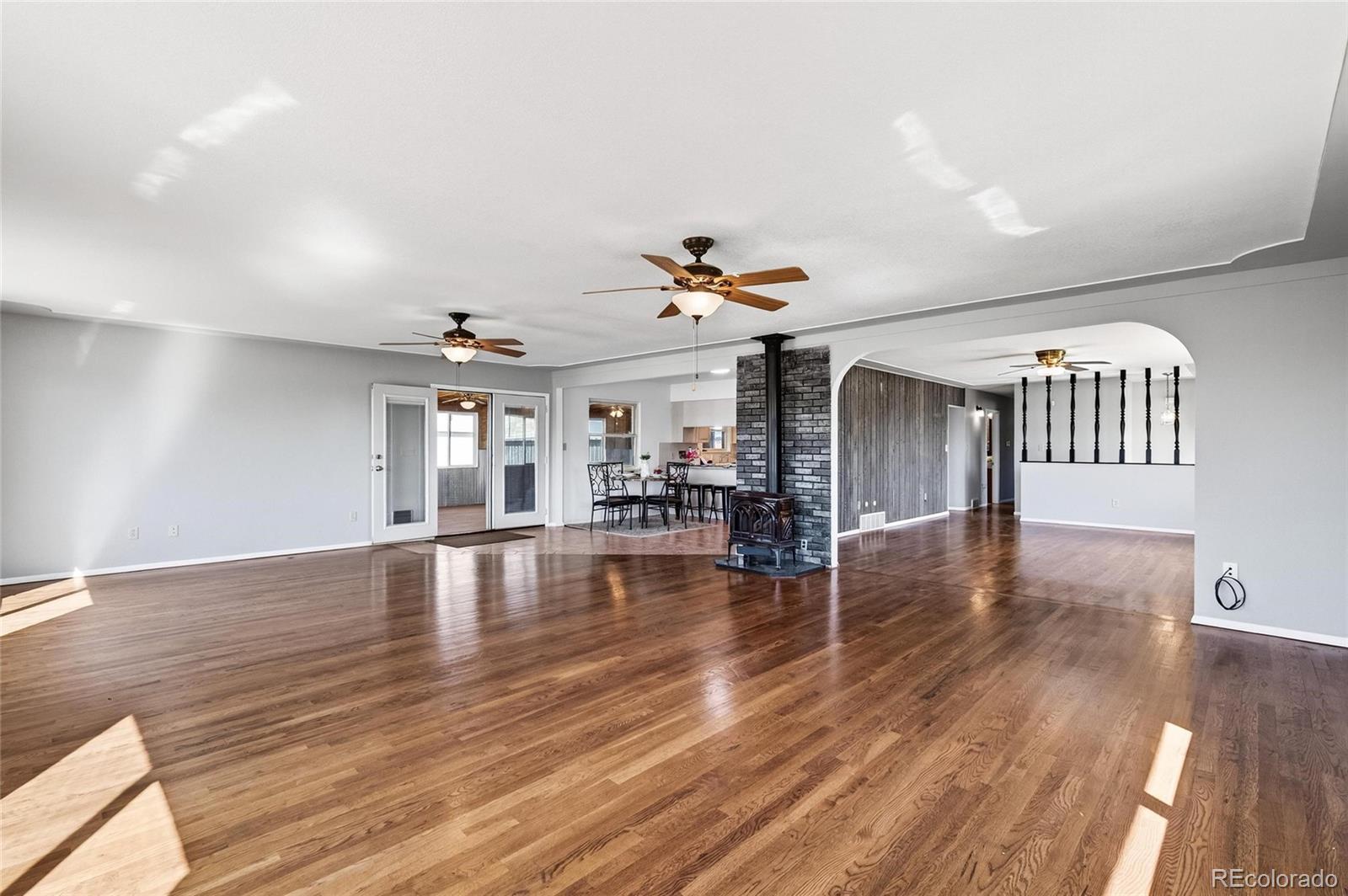 2869 Mathews Avenue Fort Lupton, CO 80621 - Photo 8 of 49 a view of a room wooden floor and staircase