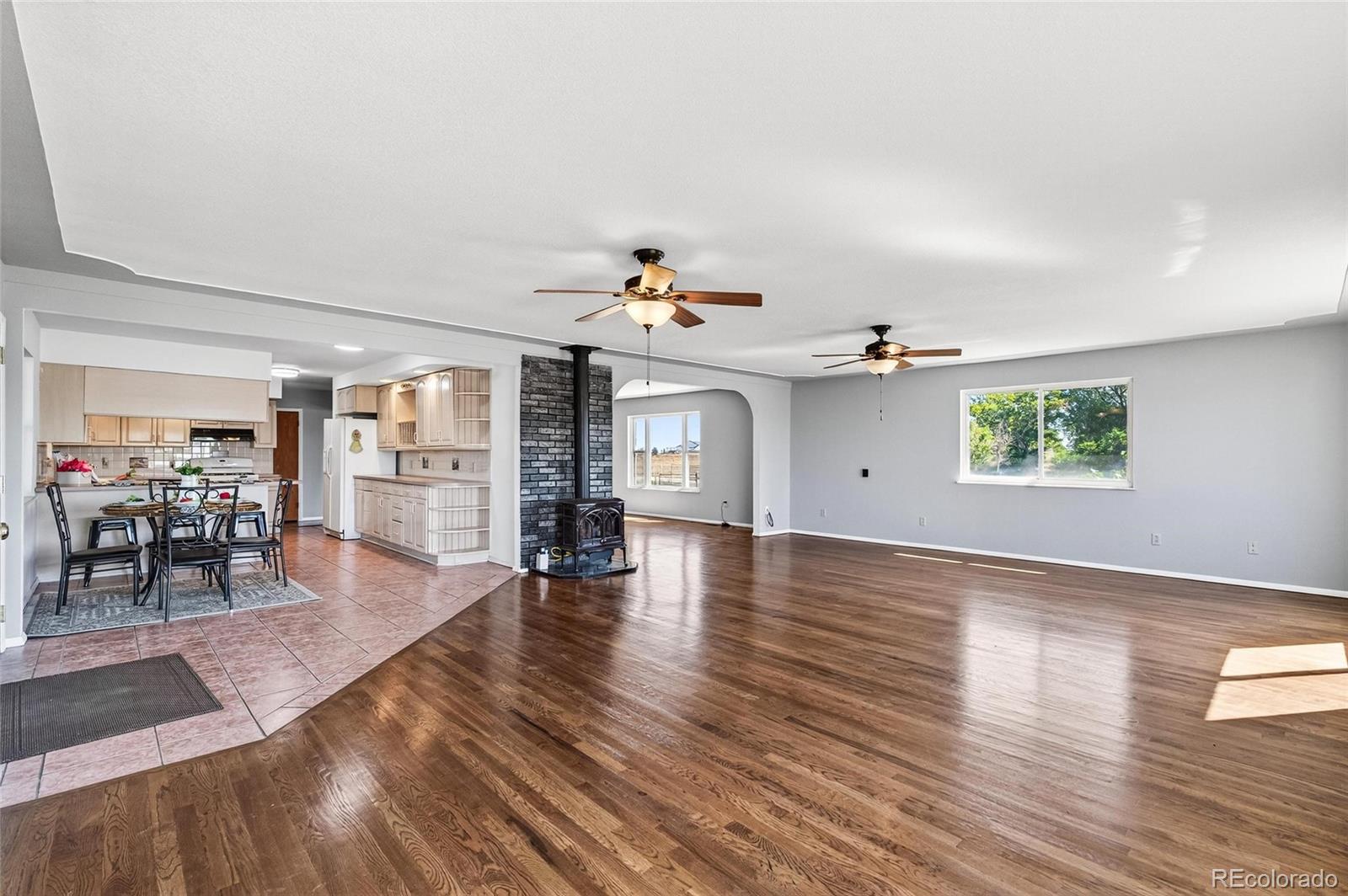2869 Mathews Avenue Fort Lupton, CO 80621 - Photo 9 of 49 a view of a living room and dining room