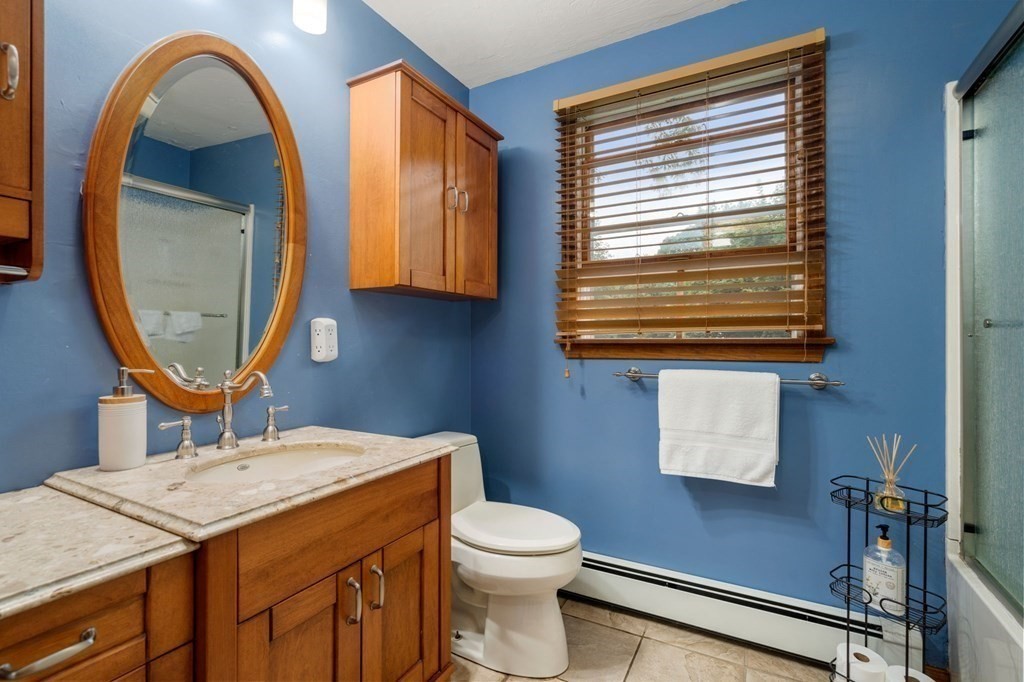 21 Summit Avenue Waltham, MA 02453 - Photo 11 of 19 a bathroom with a granite countertop toilet sink and mirror