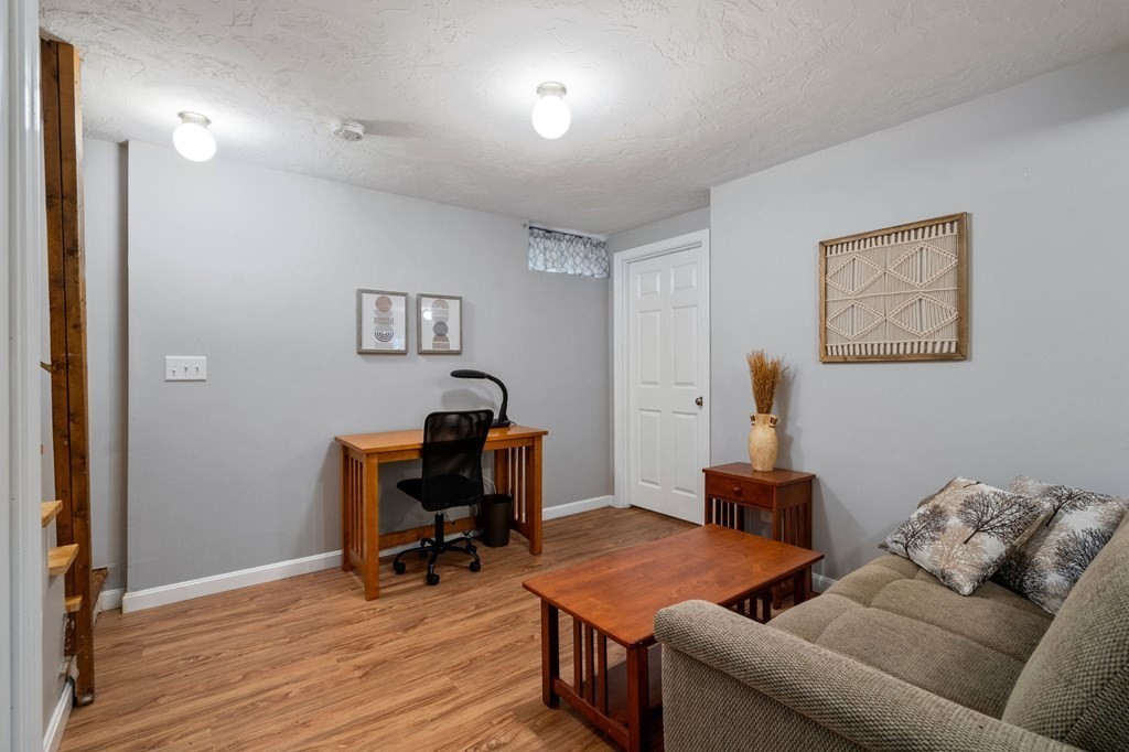 21 Summit Avenue Waltham, MA 02453 - Photo 13 of 19 a view of a workspace with furniture and a window