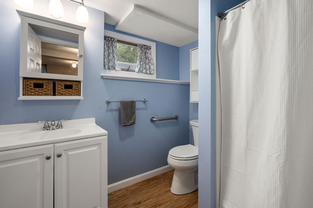 21 Summit Avenue Waltham, MA 02453 - Photo 15 of 19 a white toilet sitting next to a bathroom sink