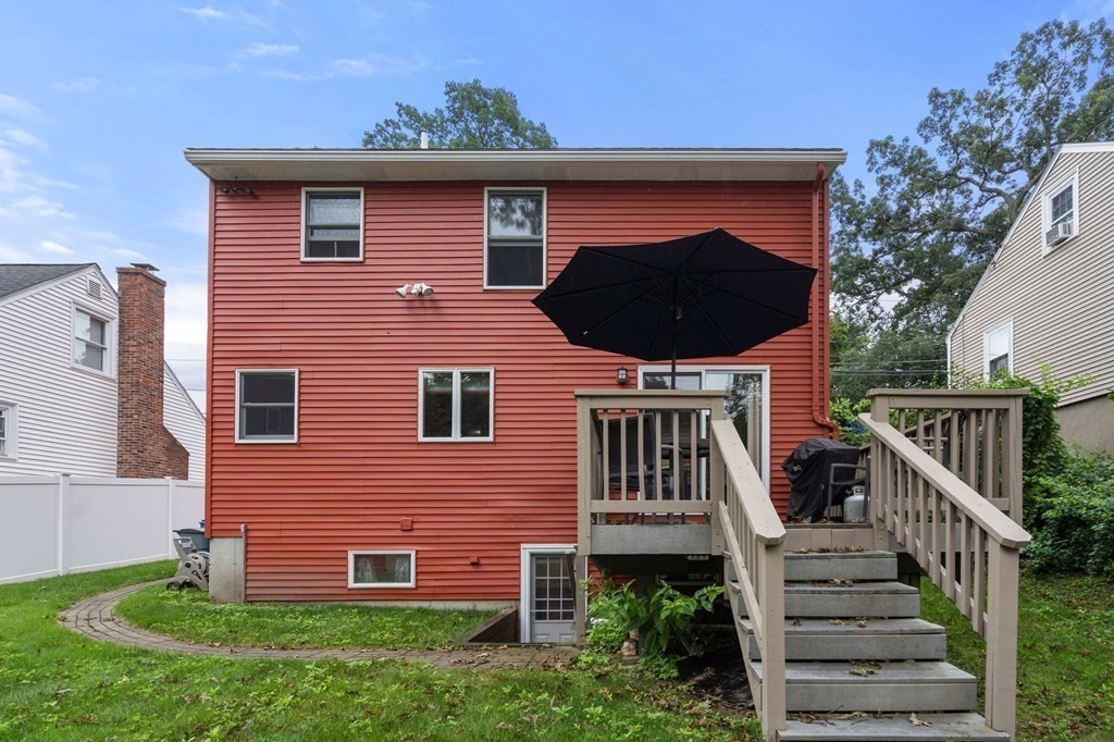 21 Summit Avenue Waltham, MA 02453 - Photo 18 of 19 a front view of a house with a yard