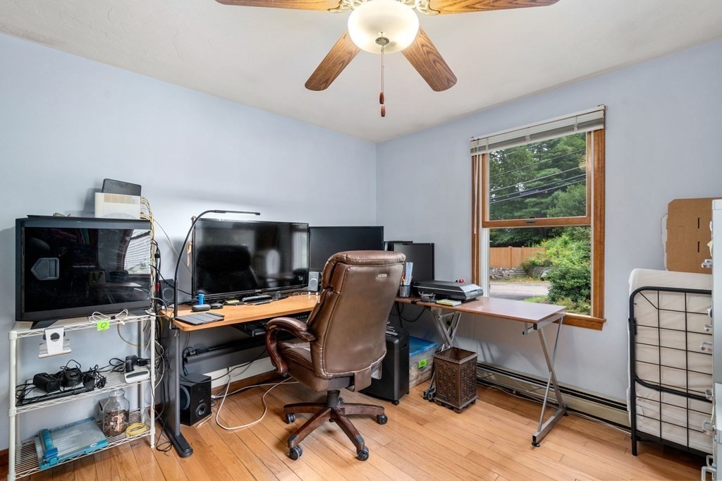 21 Summit Avenue Waltham, MA 02453 - Photo 10 of 19 a view of a workspace with furniture and a window