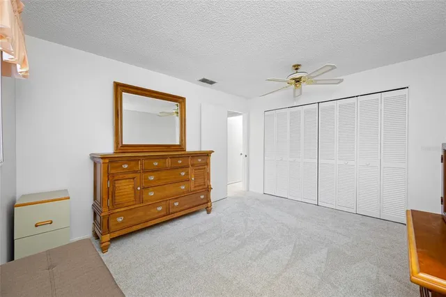 a bathroom with a sink vanity mirror and toilet