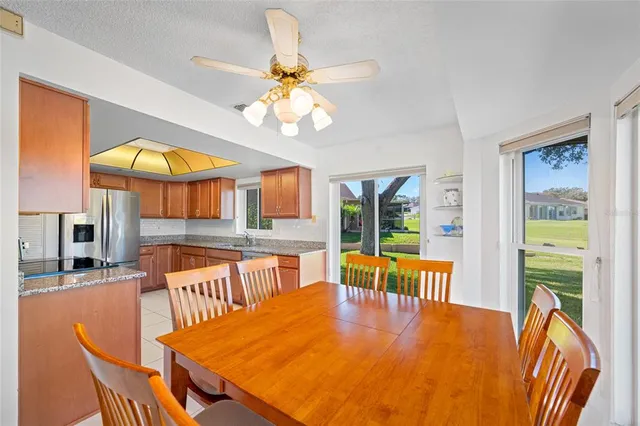 a view of a dining room with furniture window and outside view
