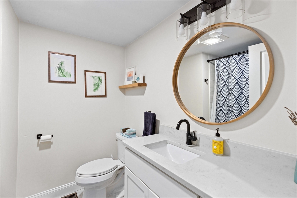 47 Pennfield Road Scituate, MA 02066 - Photo 18 of 27 a bathroom with a sink and a mirror