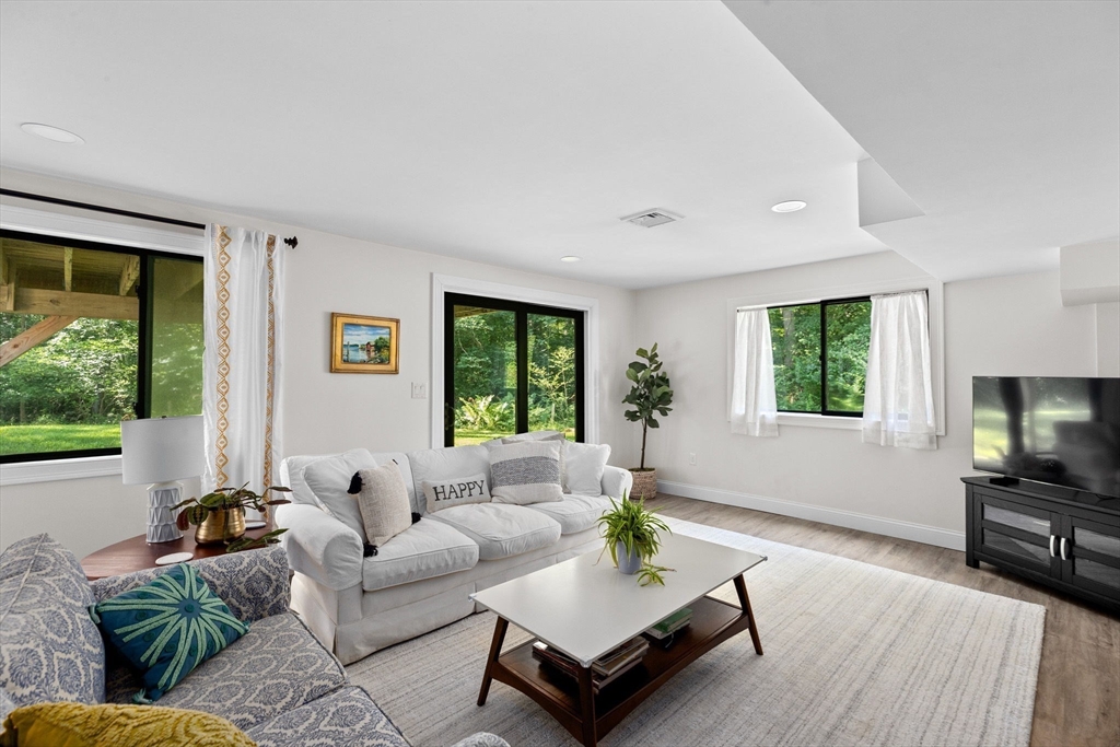 47 Pennfield Road Scituate, MA 02066 - Photo 19 of 27 a living room with furniture and a flat screen tv