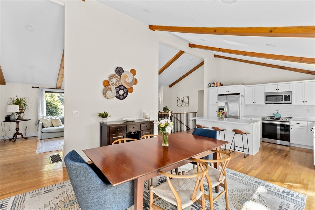 47 Pennfield Road Scituate, MA 02066 - Photo 2 of 27 a living room with furniture a fireplace and kitchen view