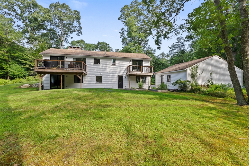 47 Pennfield Road Scituate, MA 02066 - Photo 25 of 27 a front view of house with yard and seating area