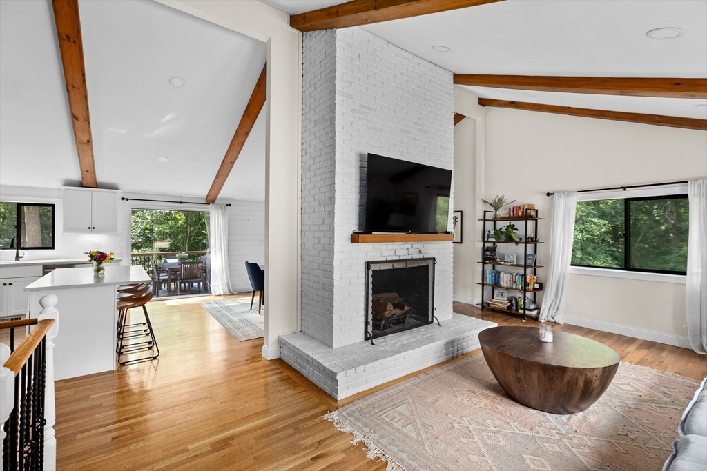 47 Pennfield Road Scituate, MA 02066 - Photo 3 of 27 a living room with furniture a flat screen tv and a fireplace