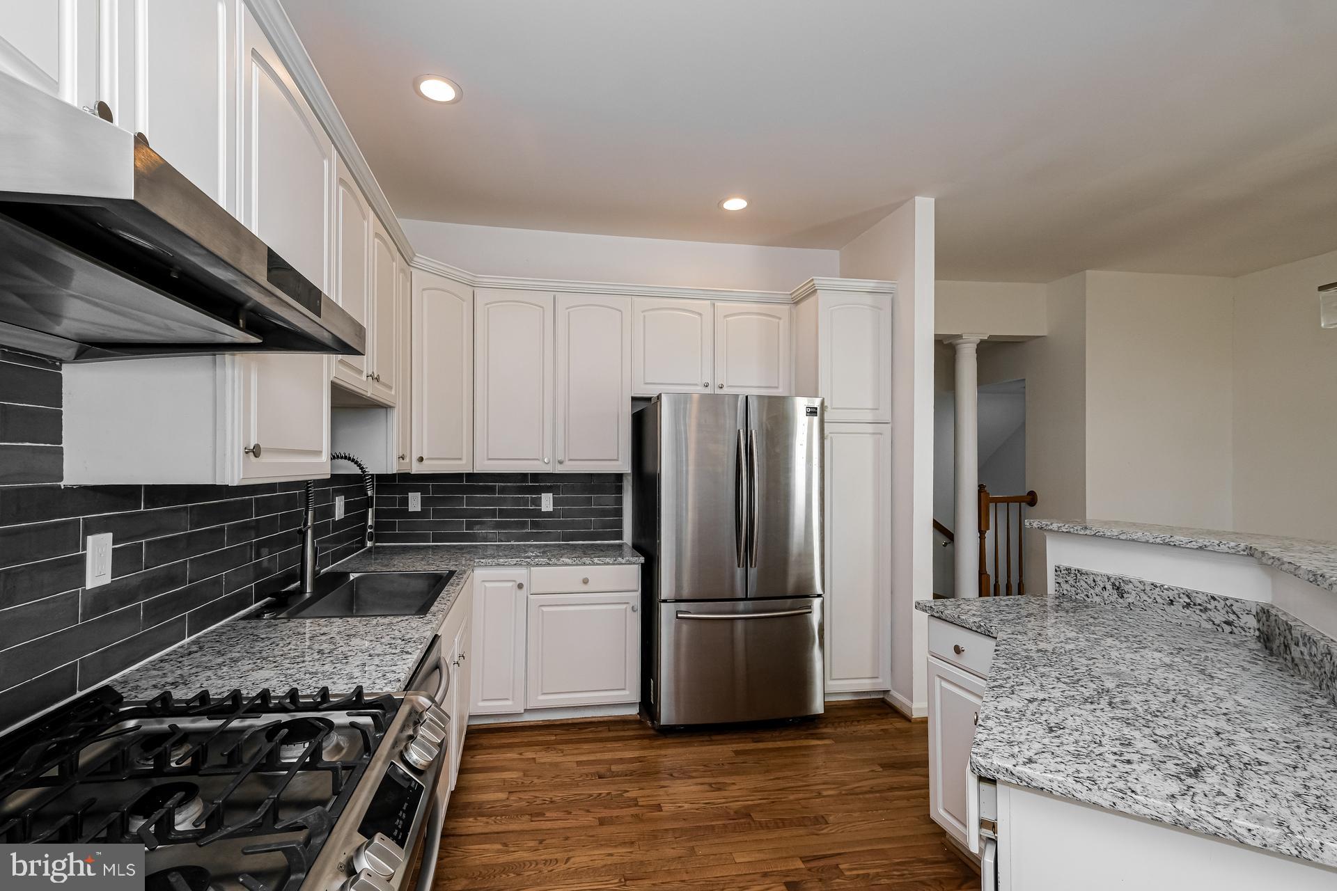 6270 Levi Court Springfield, VA 22150 - Photo 12 of 22 a kitchen with a refrigerator and a sink
