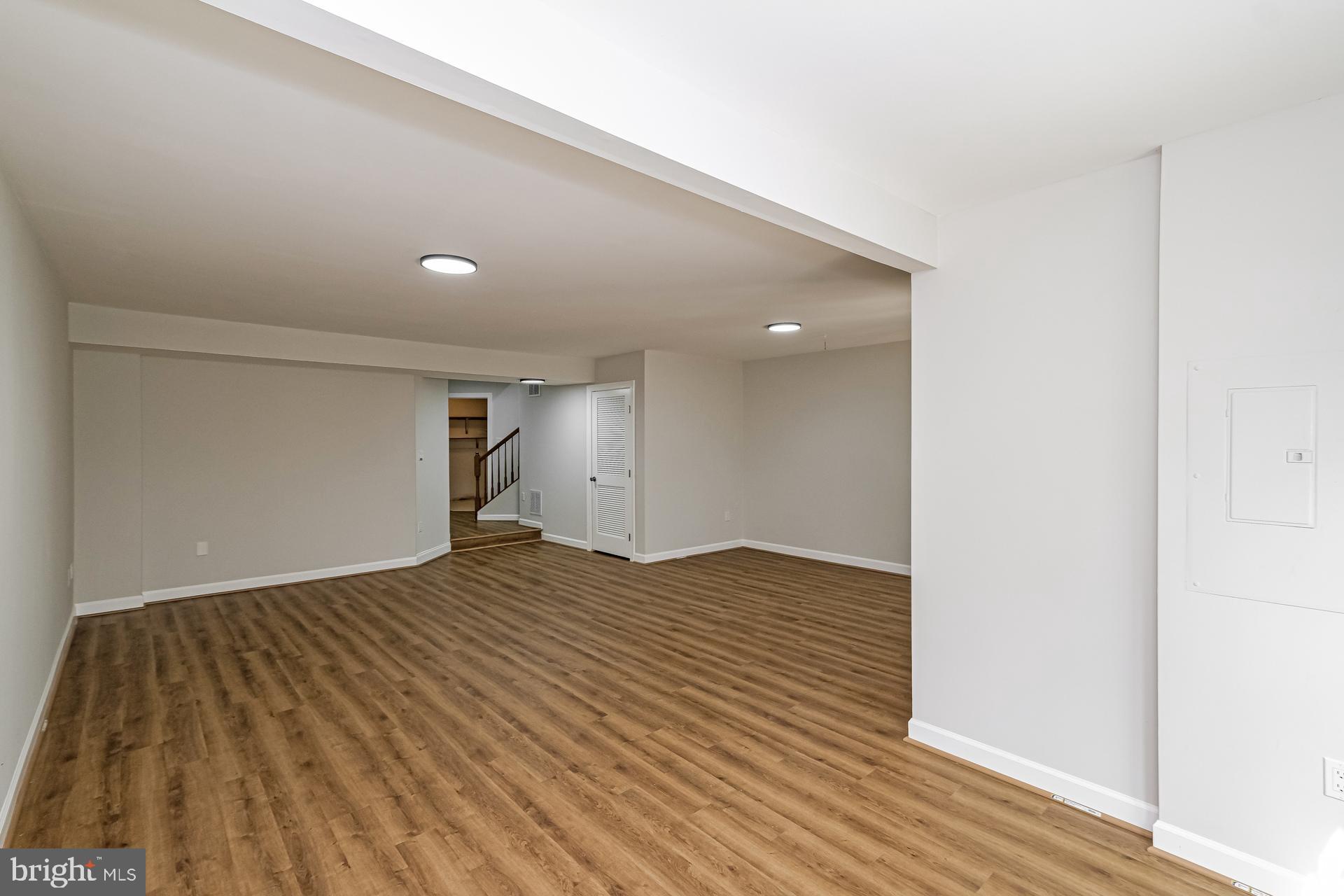 6270 Levi Court Springfield, VA 22150 - Photo 13 of 22 a view of empty room with wooden floor