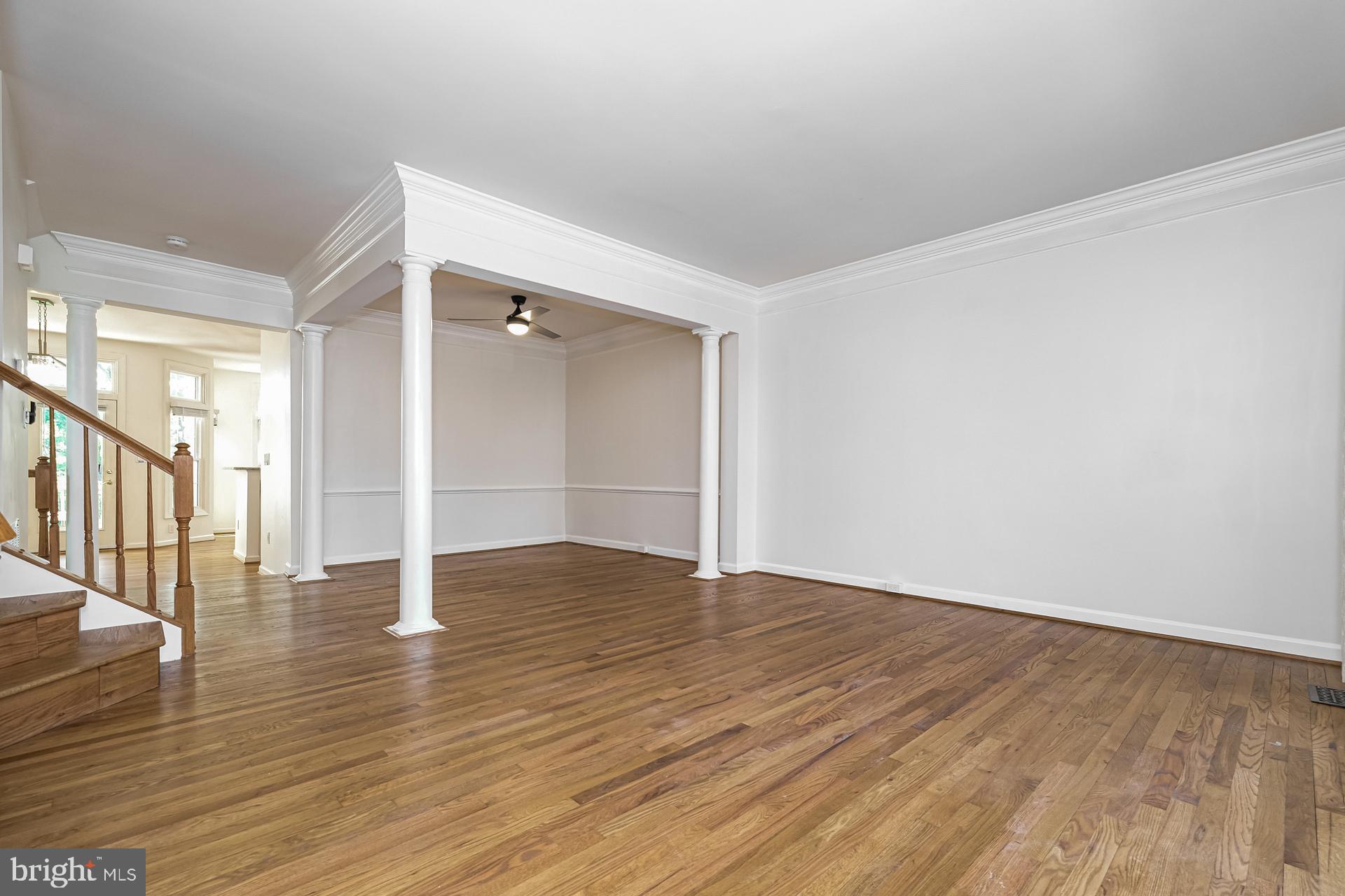 6270 Levi Court Springfield, VA 22150 - Photo 3 of 22 a view of an empty room with wooden floor and a window