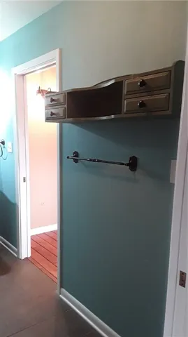 a room with cabinets and a mirror