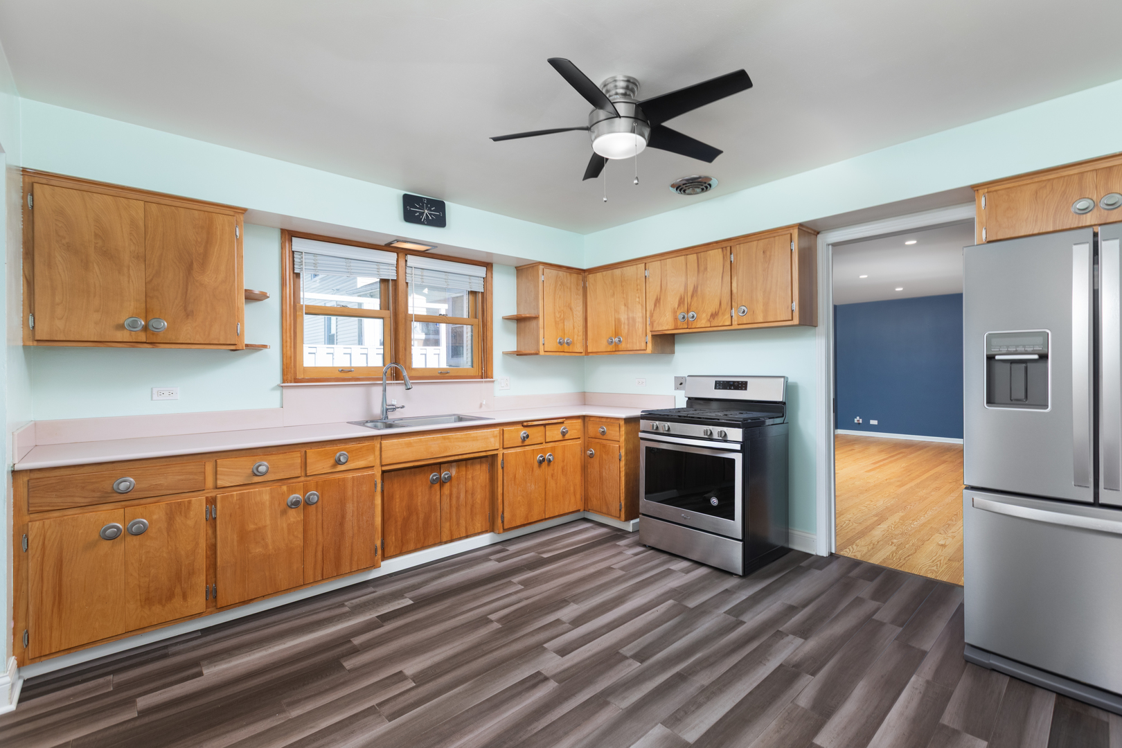 536 Prairie Avenue Downers Grove, IL 60515 - Photo 12 of 33 a kitchen with stainless steel appliances granite countertop a stove top oven a sink dishwasher a refrigerator and cabinets with wooden floor