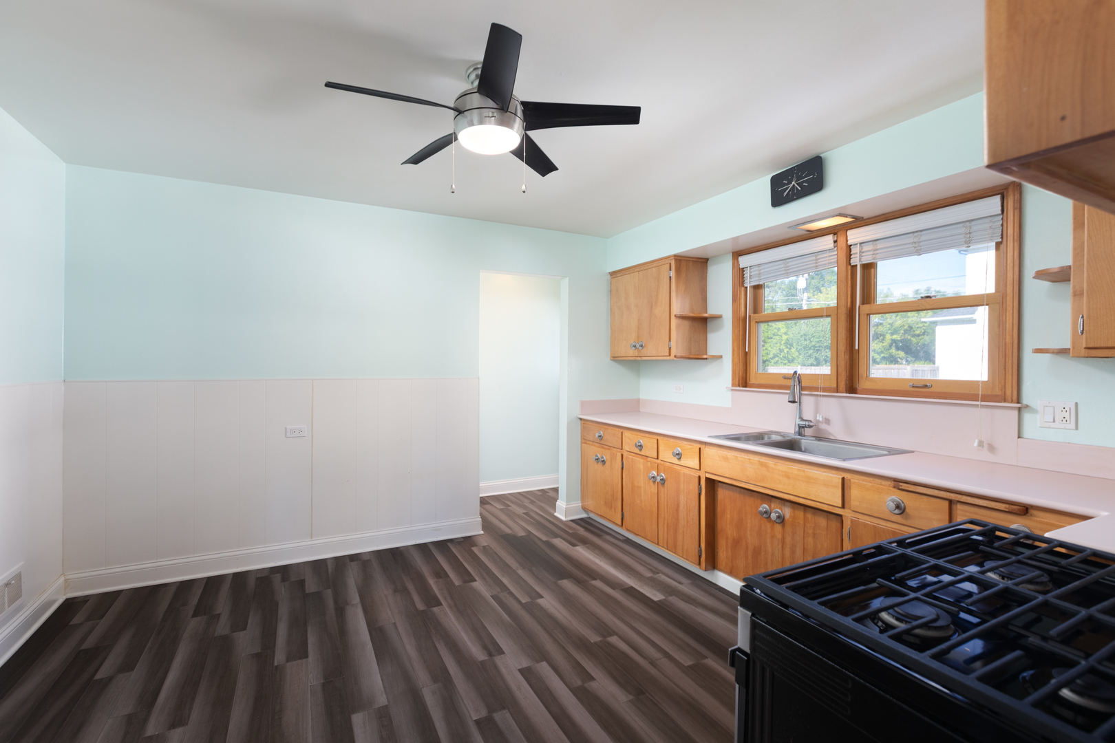 536 Prairie Avenue Downers Grove, IL 60515 - Photo 14 of 33 a kitchen with wooden floors and a stove