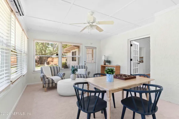 a view of a dining room with furniture window and outside view