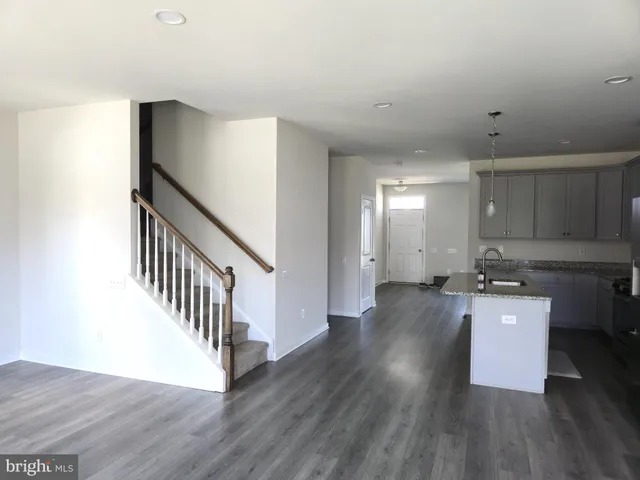 a kitchen with sink and cabinets
