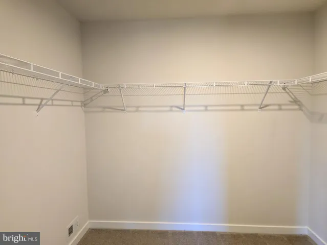 a view of a room with racks on the wall