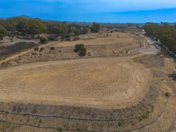 a view of a dry yard with mountain