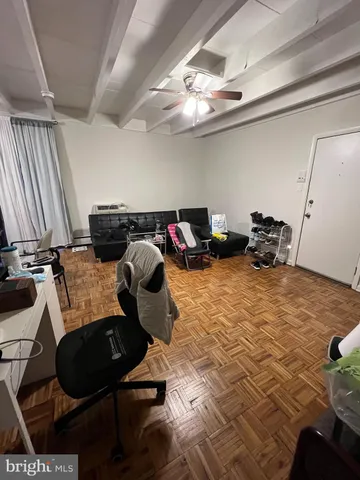 a bed room with a bed and a chair