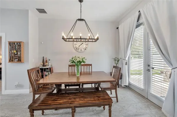 a dining room with furniture and window