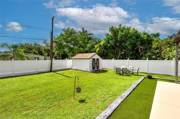 a view of a backyard with a house