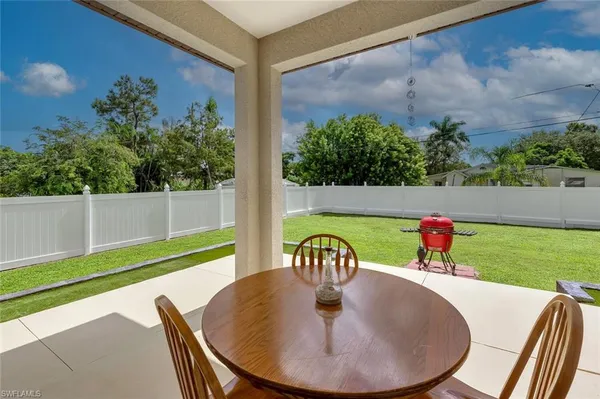 a view of a dining room with furniture window and garden