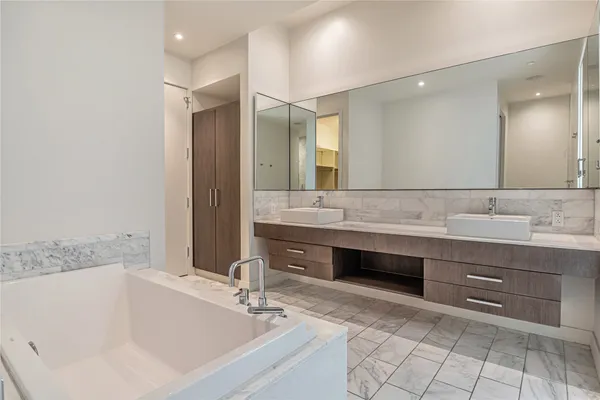 a bathroom with a double vanity sink mirror and double