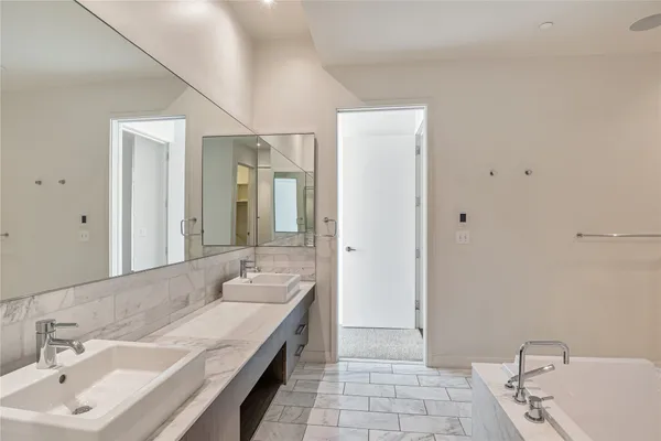 a bathroom with a double vanity sink mirror and double