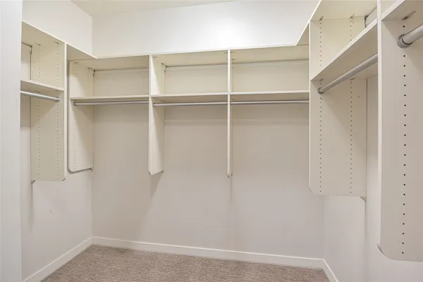 a view of an empty walk in closet