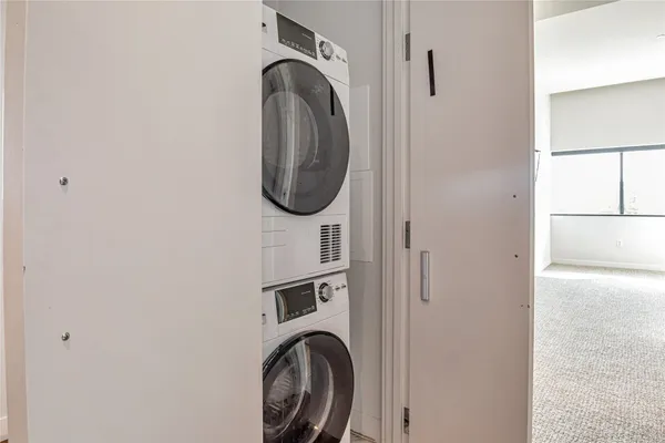 a close view of a utility room with dryer and washer