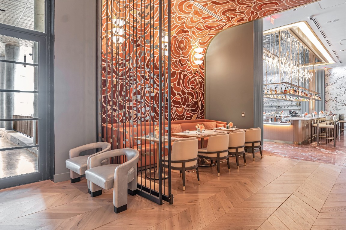 210 Lavaca Street, Unit 2903 Austin, TX 78701 - Photo 26 of 39 a dining room with furniture and a floor to ceiling window