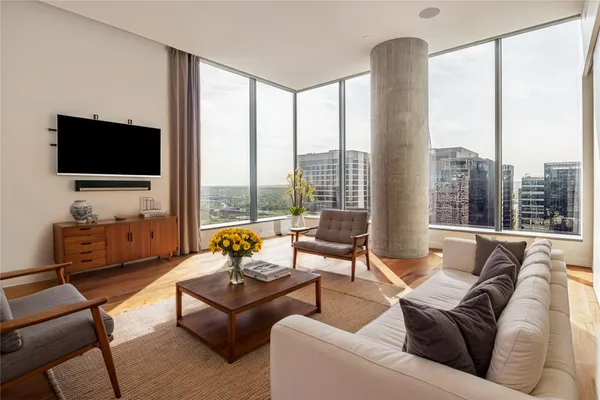 a living room with furniture and a flat screen tv