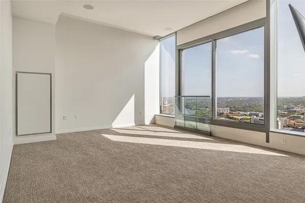 a view of room with a floor to ceiling window