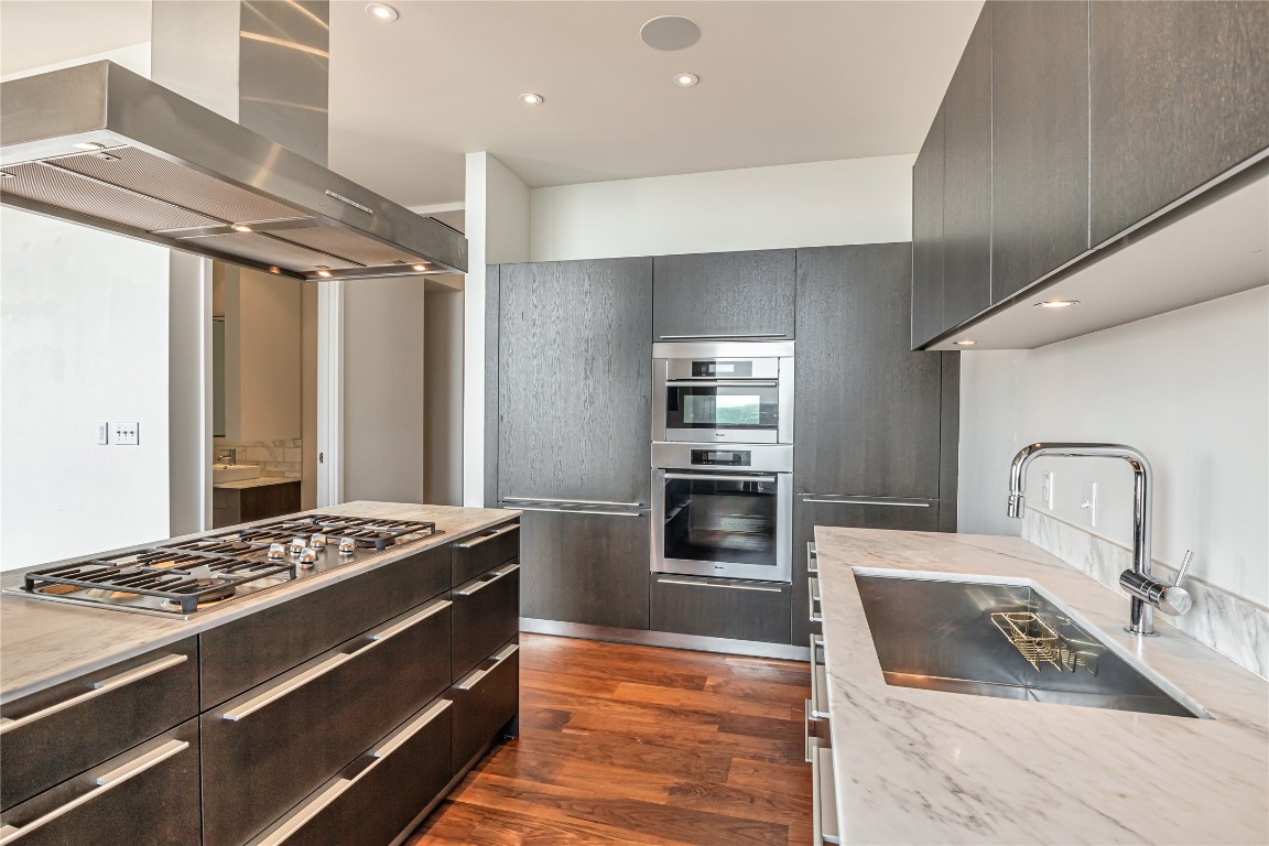 210 Lavaca Street, Unit 2903 Austin, TX 78701 - Photo 6 of 39 a kitchen with granite countertop a stove and a sink