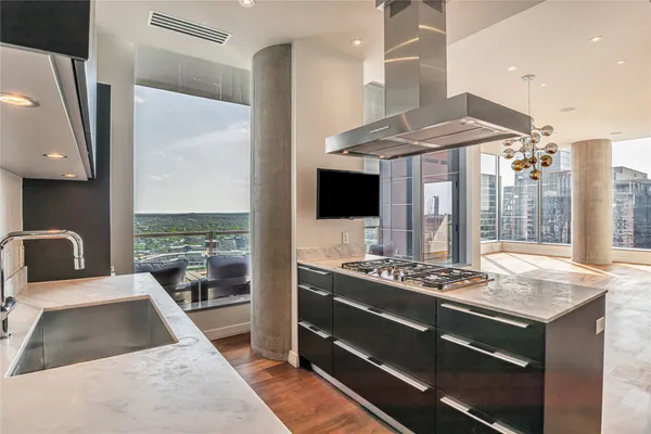 a kitchen with a stove and a refrigerator