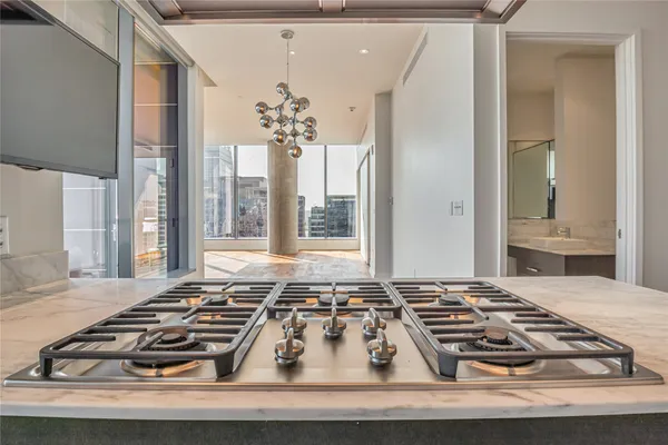 a view of a stove top oven and furniture